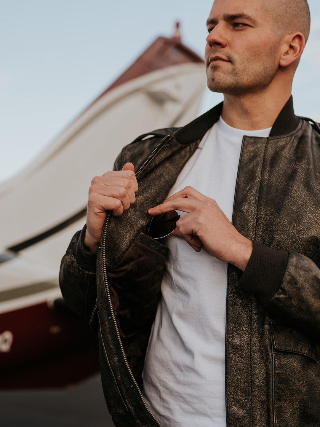 man showing inside of modern bomber jacket